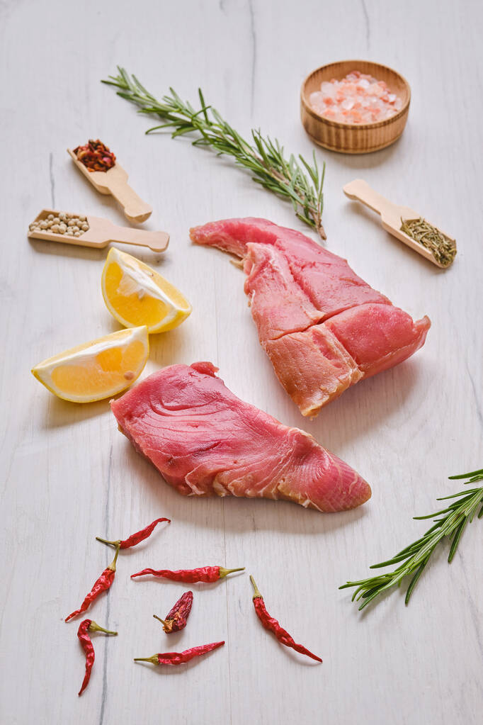 Raw fresh pieces of tuna fillet with spice - Photo, Image