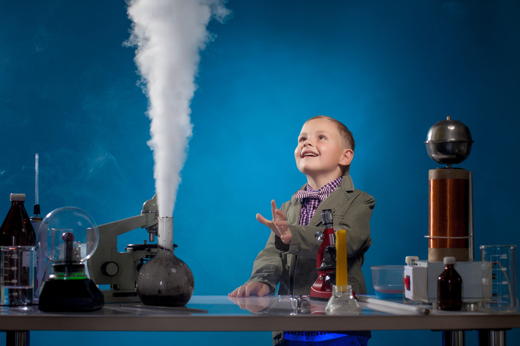 Image of joyful boy watching reagent evaporation - Photo, Image