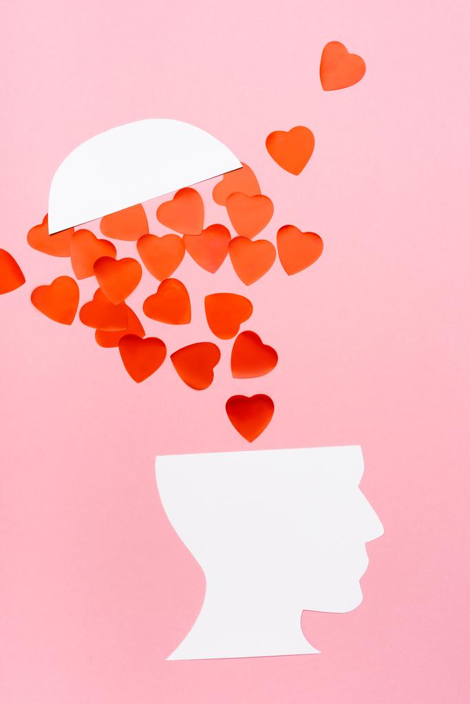 top view of paper human head and heart on pink background - Photo, Image
