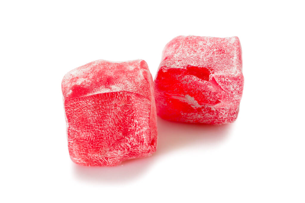 Delícia turca. Rose locum rahat, dois pedaços de doces delícias orientais em açúcar energizado, vista close-up. - Foto, Imagem