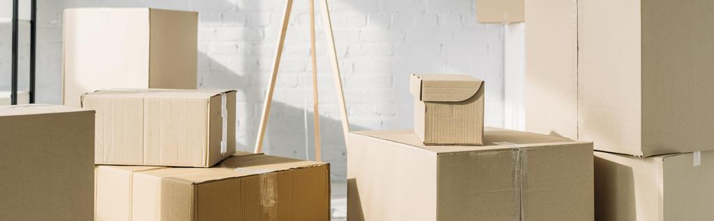 stack of carton boxes in modern apartment, banner - Photo, Image