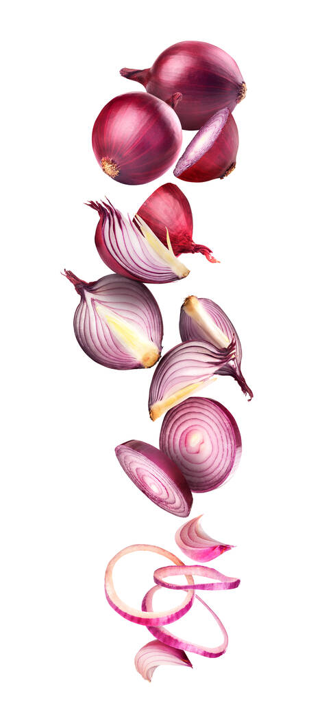 Chopped and whole onions in flight on a white background - Photo, Image