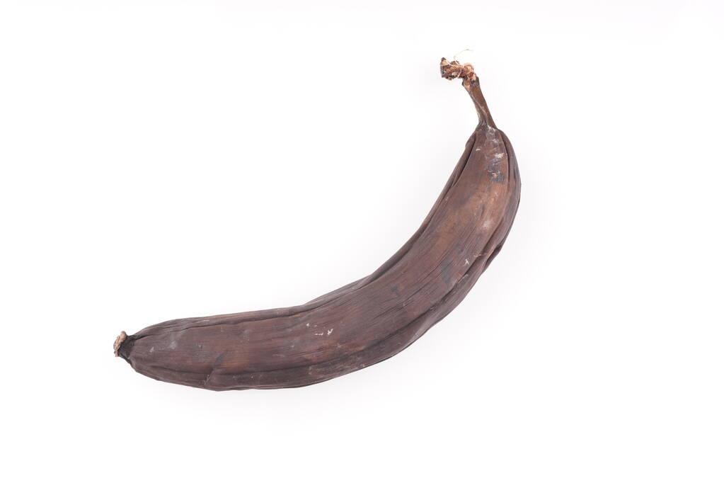 czarny banan na białym tle - Zdjęcie, obraz