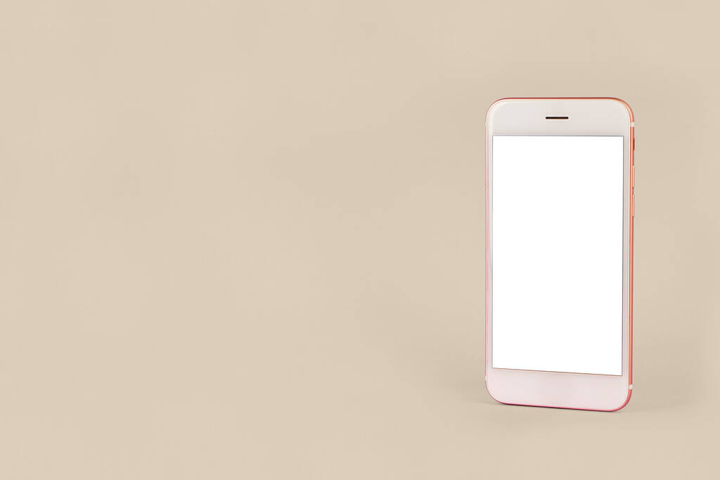 Mobile phone with copy space on pink background, minimal technology concept side view - Photo, Image