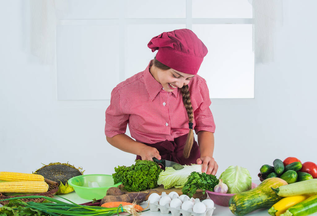 girl making dinner from vegetables, eating, happy girl - Photo, Image