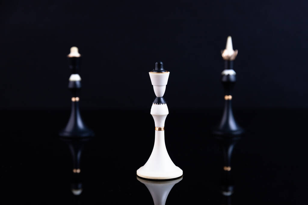 The concept of choice, merger and acquisition. Chess pieces on a black background. Selective focus. - Photo, Image