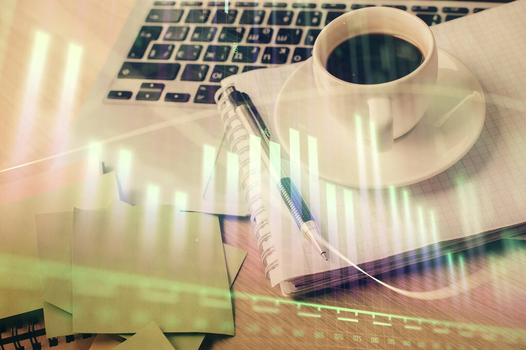 Double exposure of forex chart drawing and desktop with coffee and items on table background. Concept of financial market trading - Photo, Image