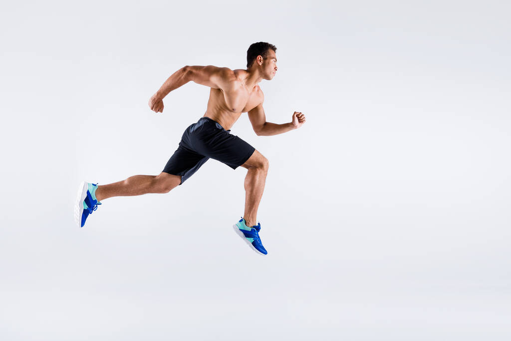 Full length body size view of his he nice attractive dedicated devoted sportive purposeful guy jumping running distance marathon cup isolated over light white pastel color background - Photo, Image