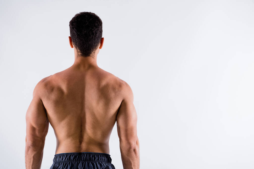 Rear back behind view of his he nice attractive content sportive tanned brunet guy steroid protein addict perfect shape figure healthy regime lifestyle isolated on light white pastel color background - Photo, Image