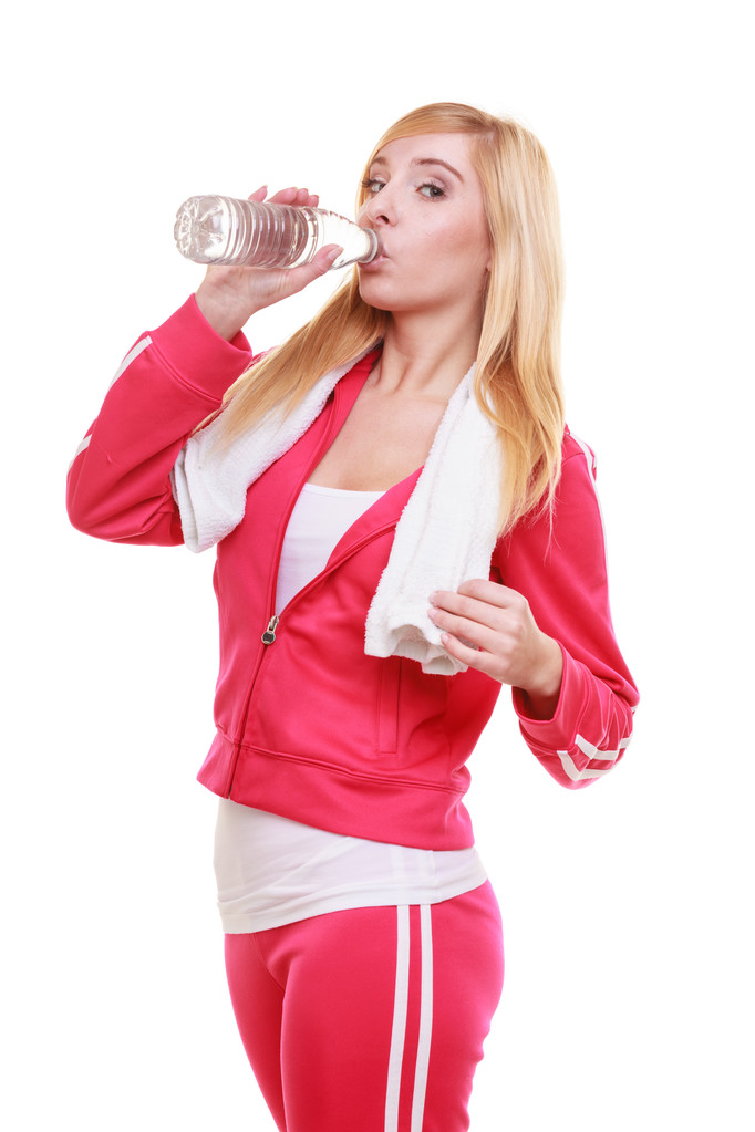 Fitness woman sport girl with towel drinking water from bottle isolated - Photo, Image