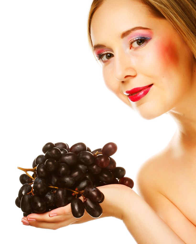Mujer con racimo de uva
. - Foto, imagen