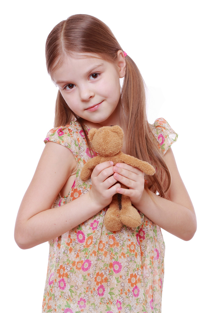 Дівчина тримає плюшеву іграшку
 - Фото, зображення