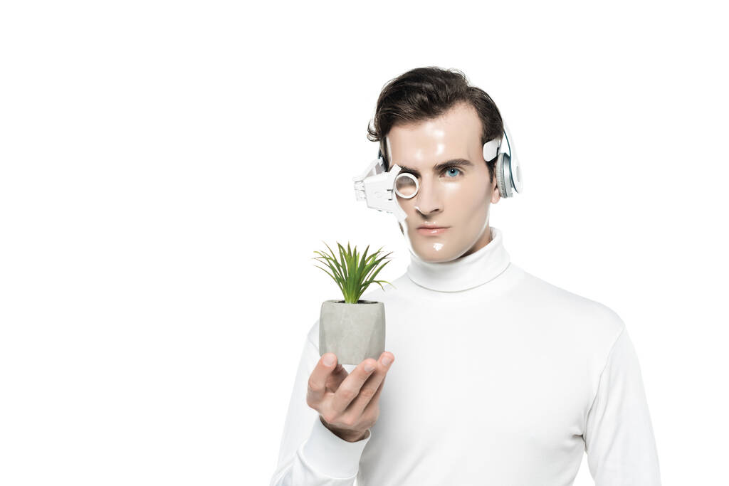 Cyborg in lente per gli occhi e cuffie con vaso con pianta isolata su bianco - Foto, immagini