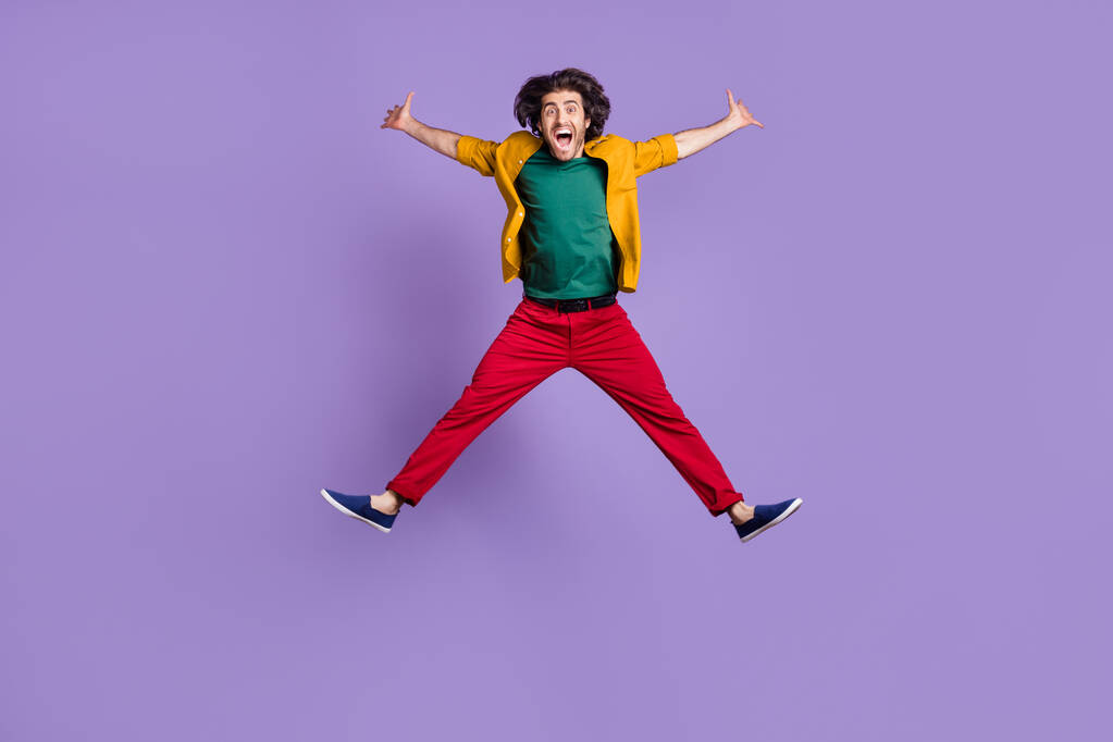 Photo portrait full body view of man spreading arms legs like star jumping up isolated on vivid purple colored background - Photo, Image