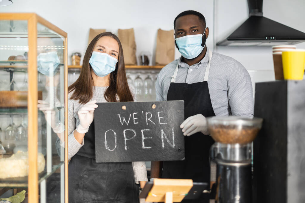 A waitress and a waiter in a medical masks - Photo, Image