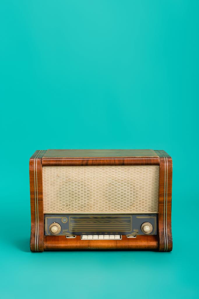 wooden radio on turquoise background with copy space - Photo, Image