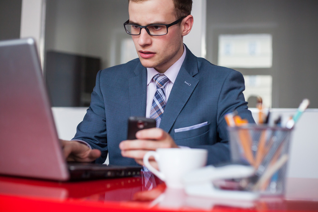 Businessman with laptop and mobile phone - Photo, Image