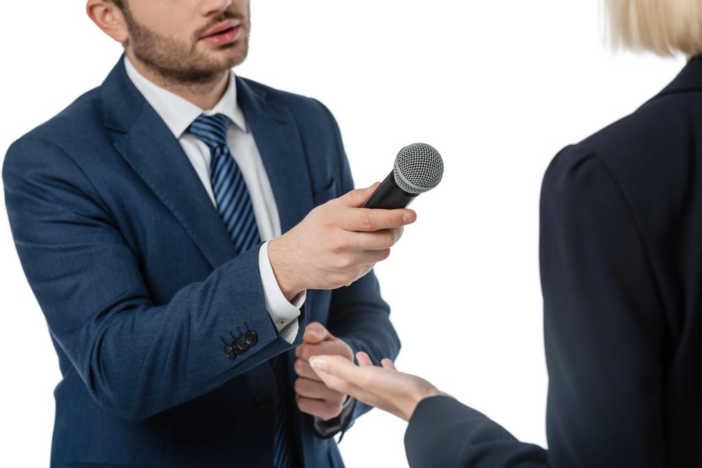 cropped view of newscaster with microphone taking interview from businesswoman isolated on white - Photo, Image