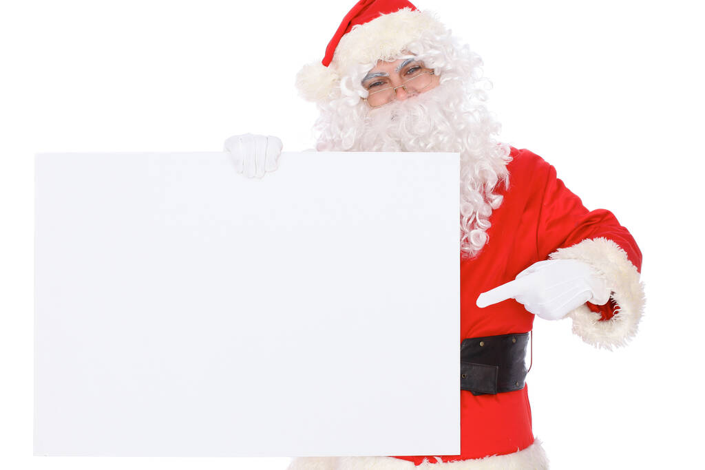 Santa Claus pointing on blank white wall, advertisement banner with copy space. Isolated on white background - Fotoğraf, Görsel