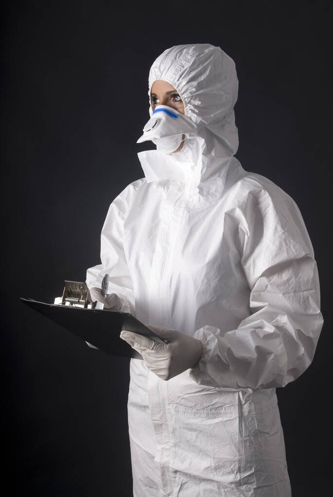 mulher vestida contraiu protetor para evitar contágio por ebola, coronavírus ou pandemia - Foto, Imagem