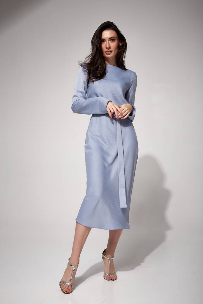 sexy brunette woman luxury lifestyle bright makeup wear natural organic blue silk midi dress high heels perfect body shape fashion model style for meeting party romantic date studio grey background. - Photo, Image