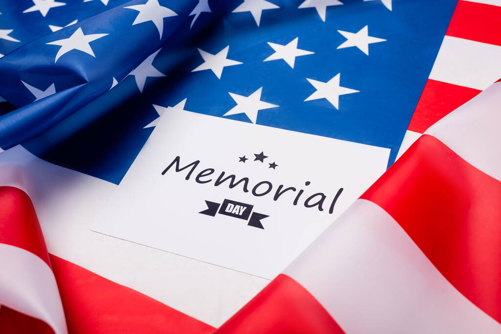 Memorial day lettering on card on american flag  - Photo, Image