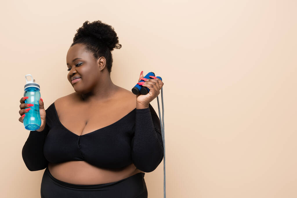Happy plus size african american woman wearing - Stock Photo