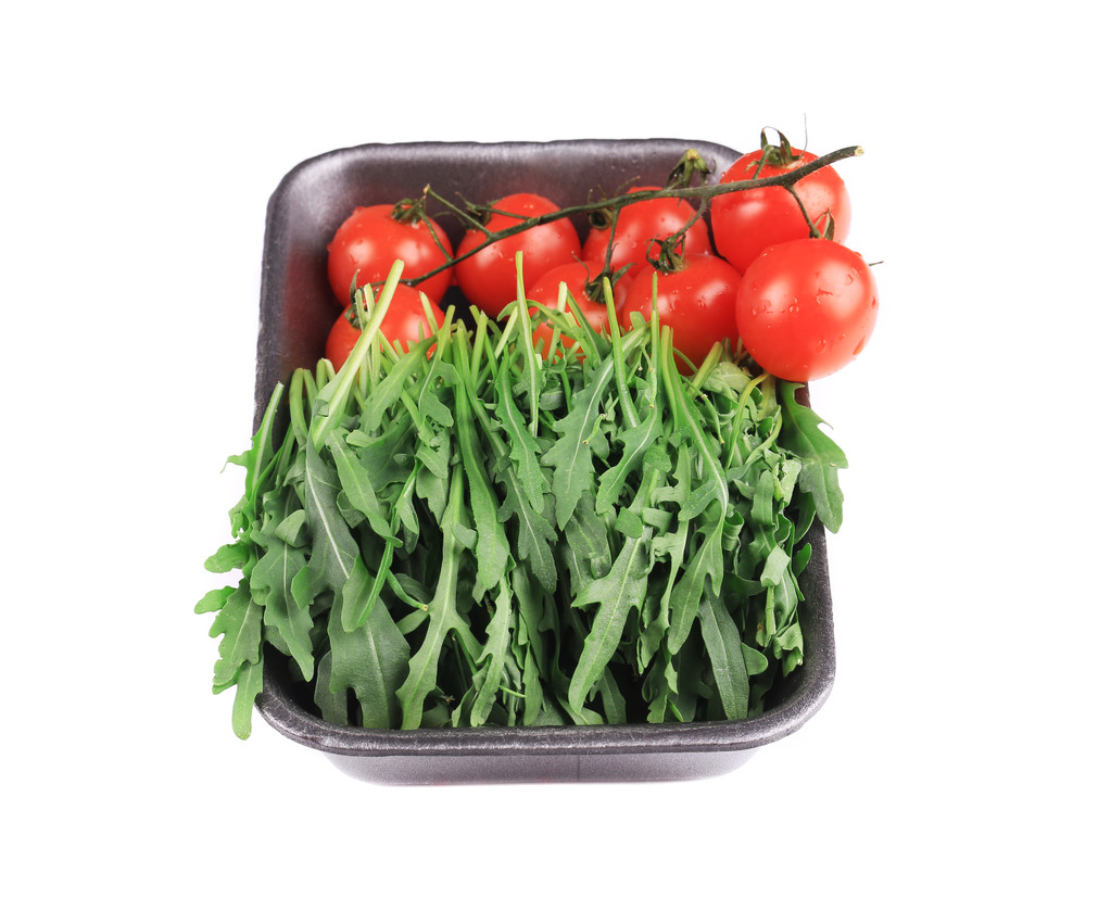 frische Rucola und saftige Tomaten. - Foto, Bild