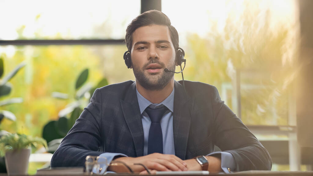bearded operator in headset with microphone talking in office - Photo, Image