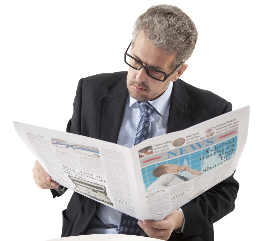 Бізнесмен читає газету
 - Фото, зображення