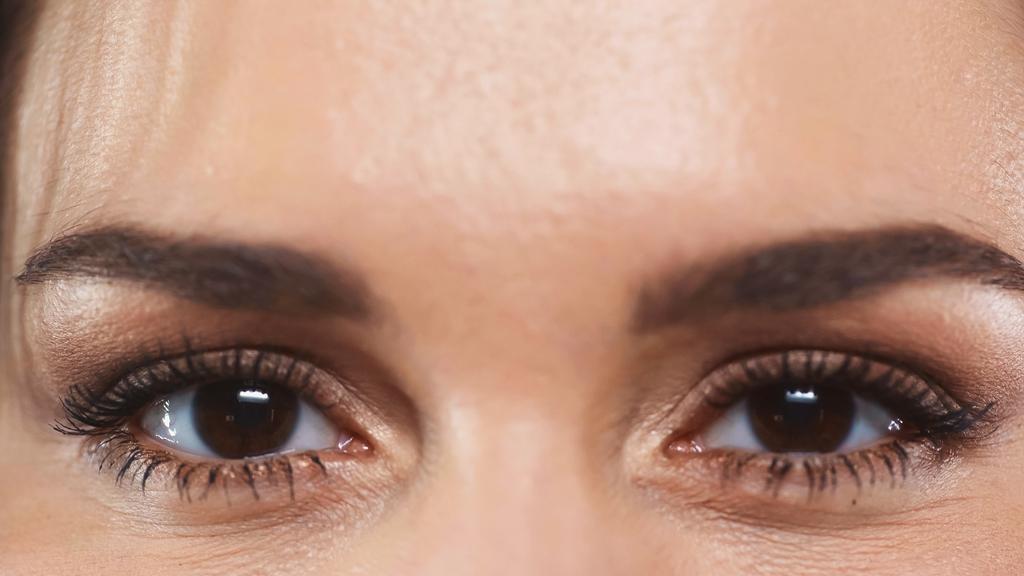 partial view of woman with brown eyes looking at camera - Photo, Image