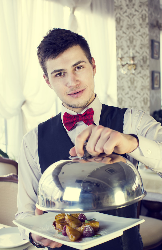 Waiter with a tray of food - Photo, Image