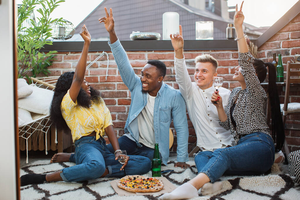 Multicultural cheerful friends having party on rooftop - Photo, Image