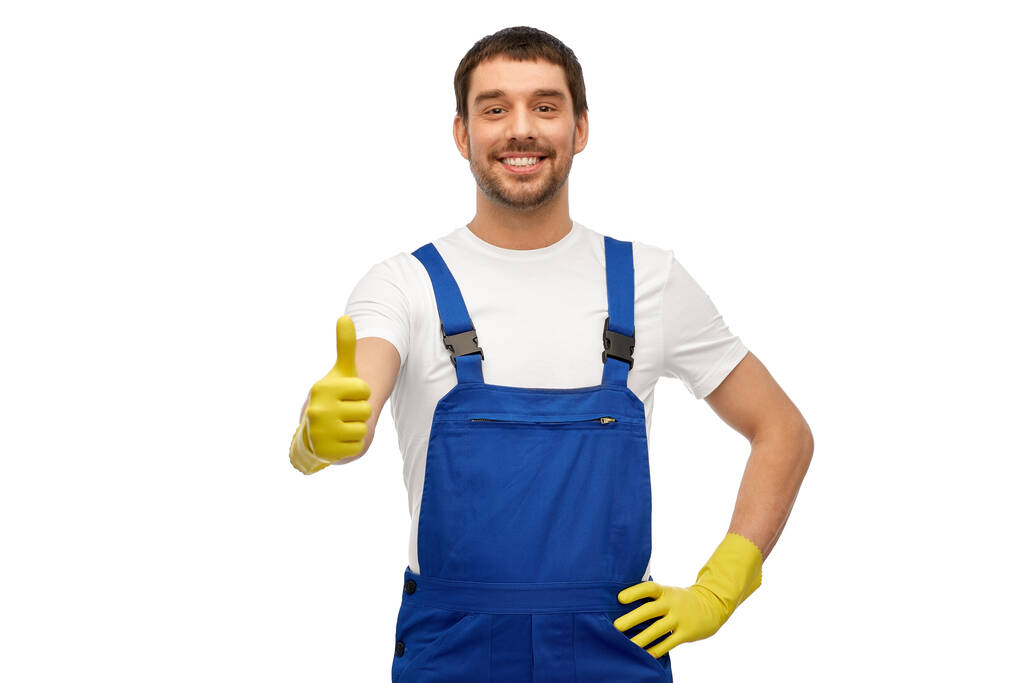 счастливый мужчина работник или уборщик в целом и перчатки - Фото, изображение