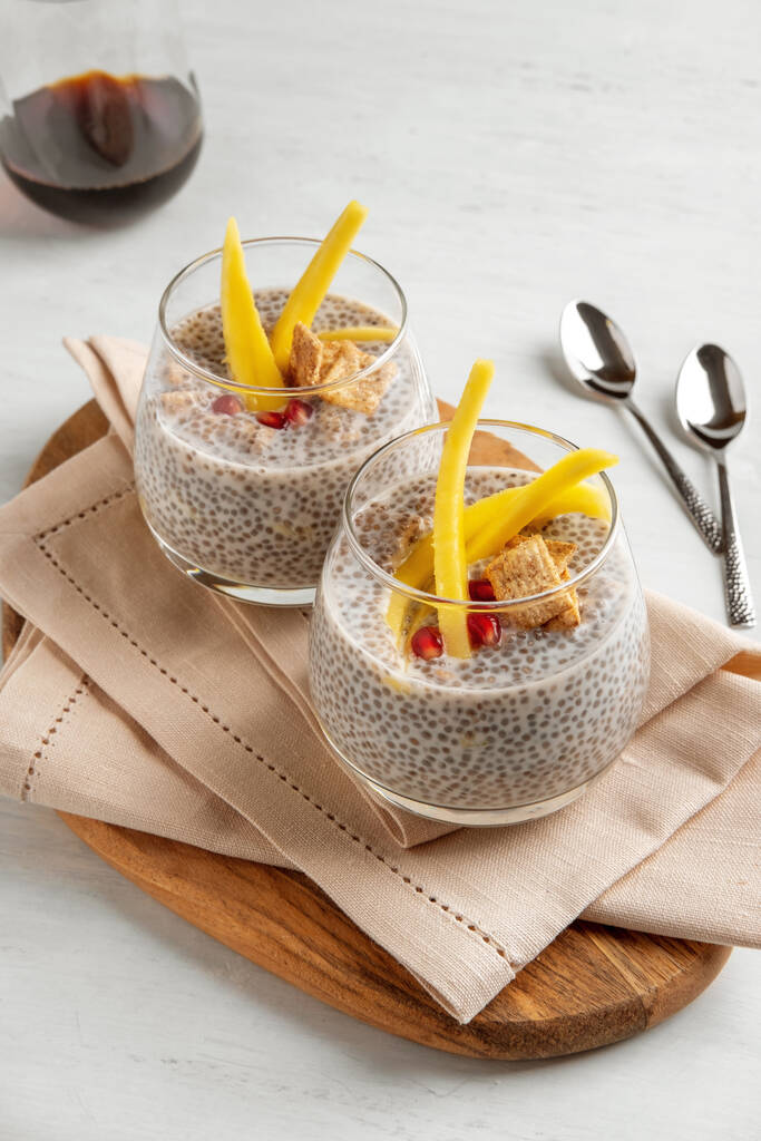 Vegan chia coconut pudding with mango on white background. Healthy nutrition, superfood. Closeup view. - Photo, Image
