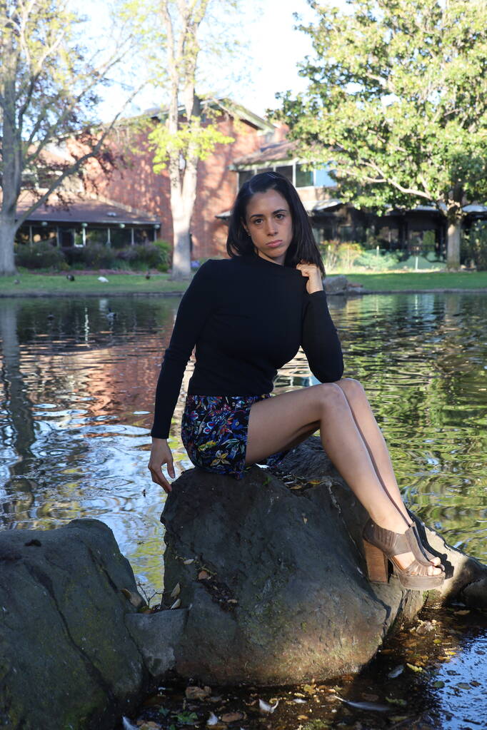 Photoshoot of a Hispanic model in a park - Photo, Image