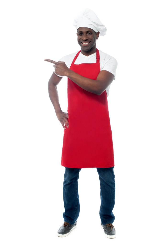 chef-kok in uniforme wijzen weg - Foto, afbeelding