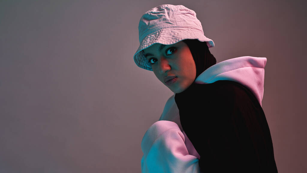 Fashionable young arabian girl in hijab and panama hat - Photo, Image