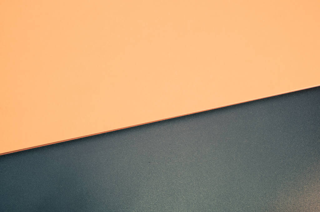 Nahaufnahme einer schwarzen Mattenstruktur auf orangefarbenem Hintergrund - Foto, Bild