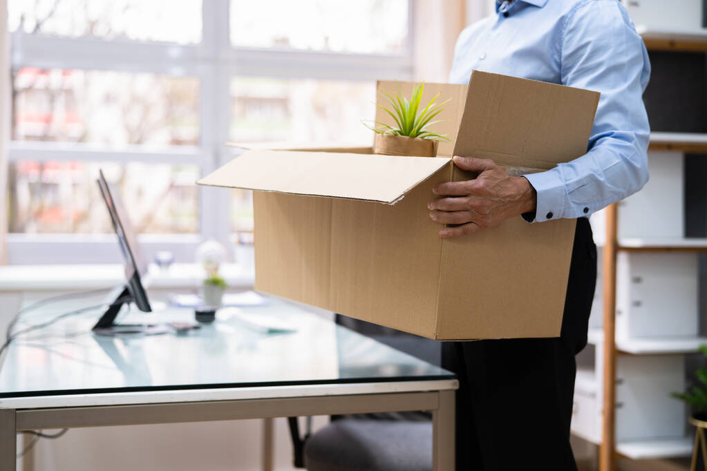 Job Quit. Employee Holding Cardboard Box At Desk - Photo, Image
