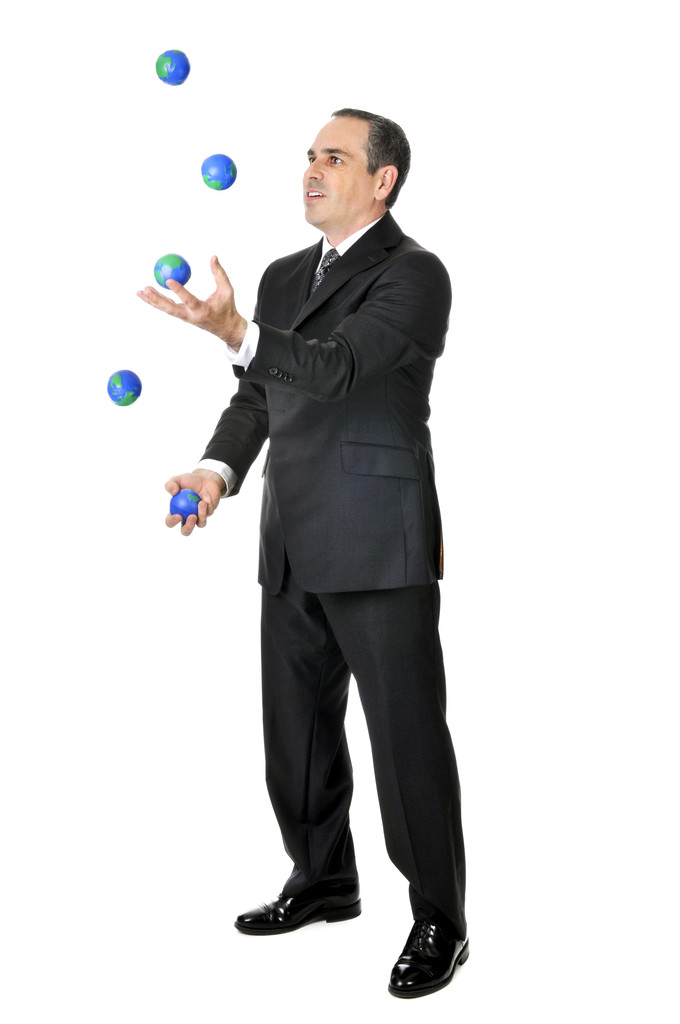 Hombre de negocios en traje malabares planeta tierra bolas
 - Foto, Imagen