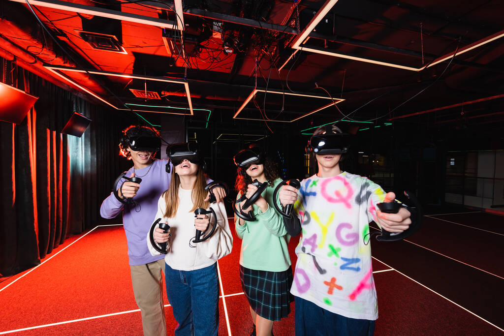 amazed multiethnic teenagers gaming in vr headsets  - Photo, Image