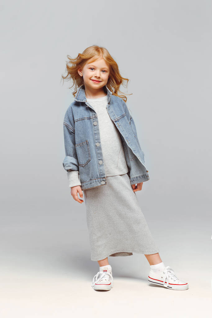 portrait of a little fashionable girl in the studio - Photo, Image