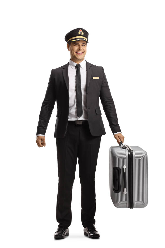 Full length portret van een hotel portier met een koffer geïsoleerd op witte achtergrond - Foto, afbeelding