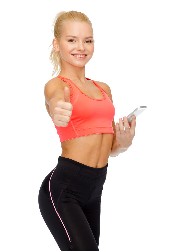 mujer deportiva sonriente con teléfono inteligente
 - Foto, Imagen