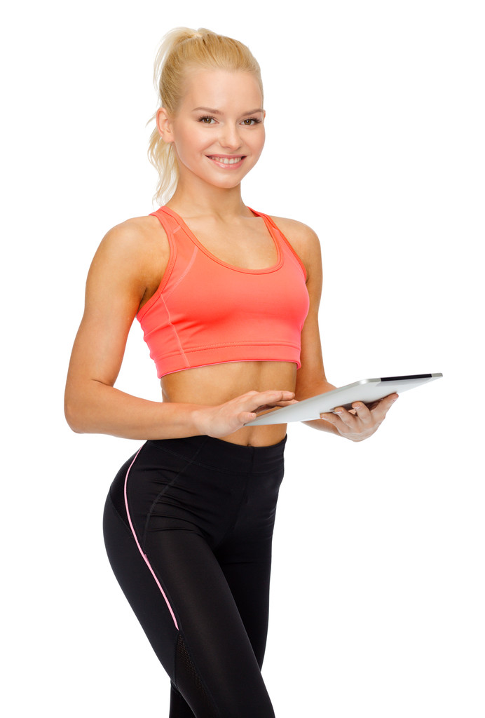 mujer deportiva sonriente con la computadora de la tableta PC
 - Foto, imagen