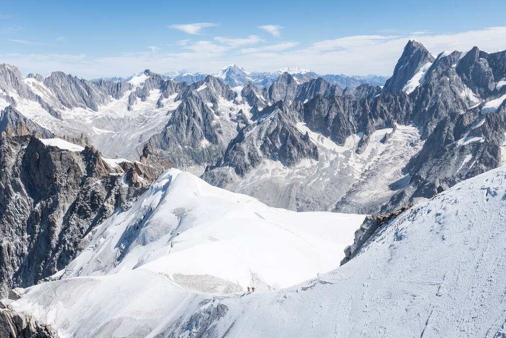 A gorgeous view of the snowy peak of Aiguille du Midi in the French Alps - Photo, Image