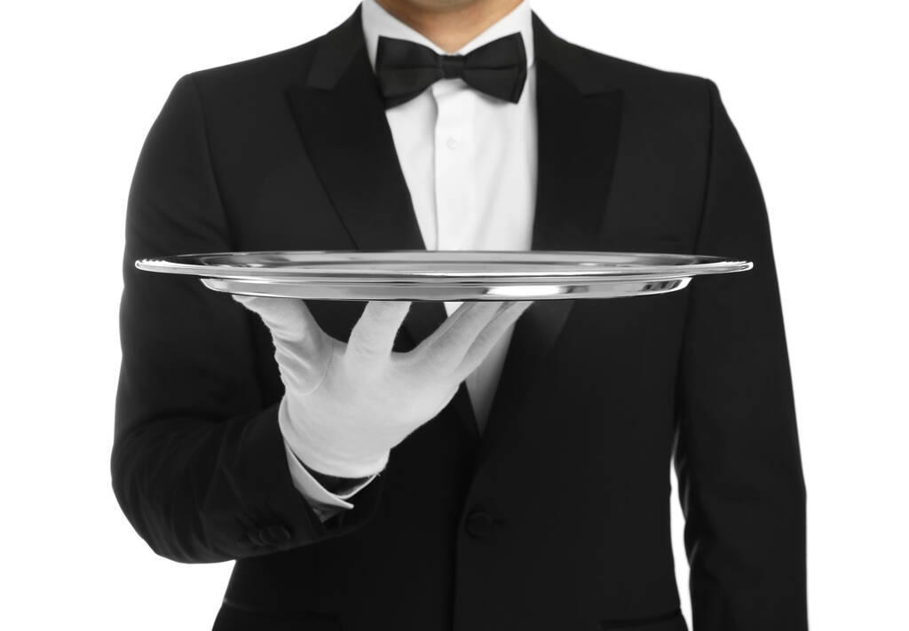 Elegante butler met zilveren dienblad geïsoleerd op wit, close-up - Foto, afbeelding