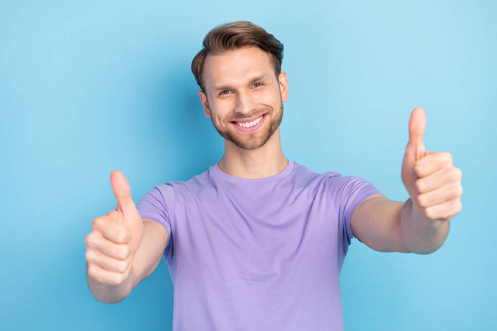 Photo portrait of man showing thumb-up sign like isolated on pastel blue color background - Photo, Image