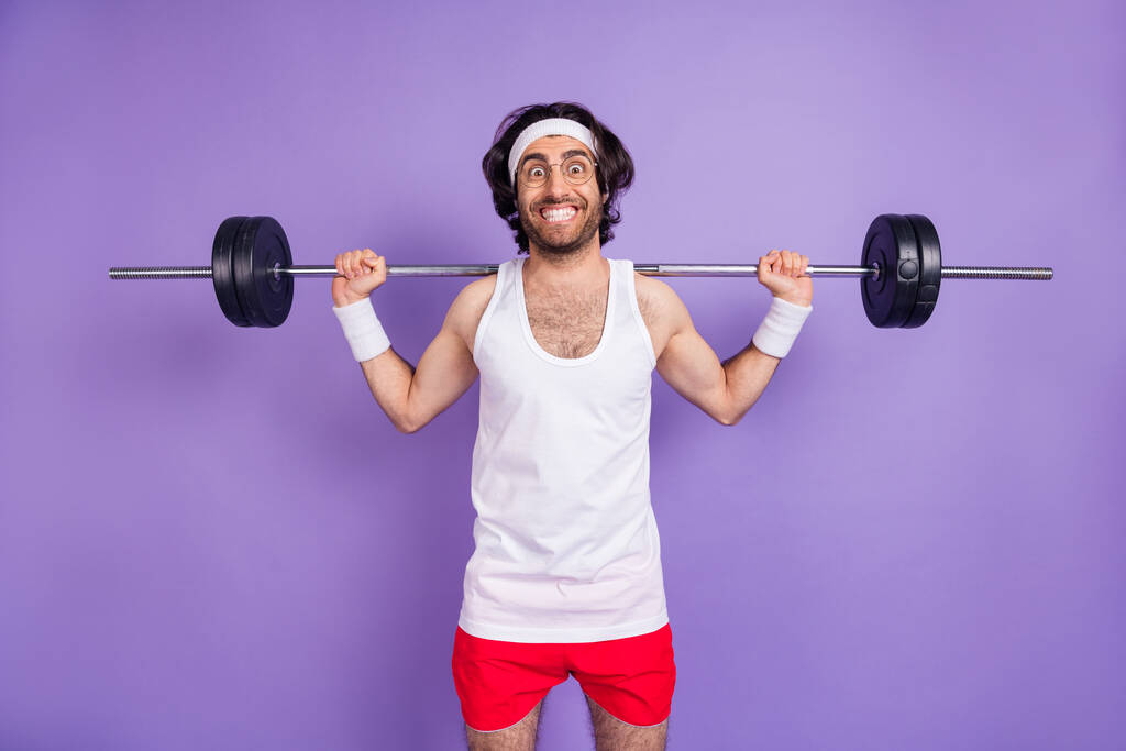 Photo of optimistic brunette guy hold barbell wear spectacles white singlet red shirts isolated on lilac color background - Photo, Image